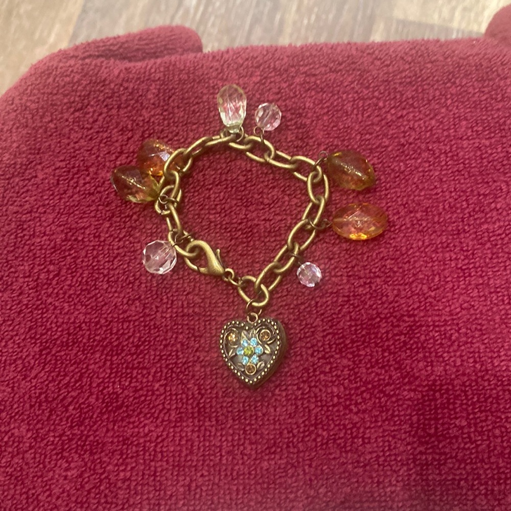 Bracelet, with locket, and charms